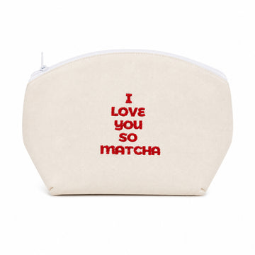A cream-colored canvas zippered pouch with red embroidered text reading 'I LOVE YOU SO MATCHA' on the front, set against a plain white background.